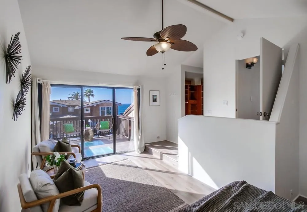 141 Sea Cliff Way Del Mar, CA 92014 - Photo 35 of 65 a living room with furniture and a floor to ceiling window