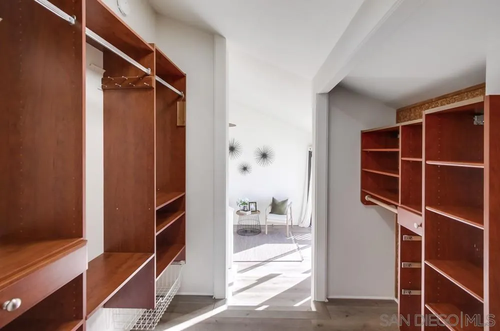 141 Sea Cliff Way Del Mar, CA 92014 - Photo 43 of 65 a view of walk in closet with empty racks