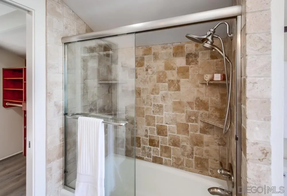 141 Sea Cliff Way Del Mar, CA 92014 - Photo 45 of 65 a bathroom with a shower and a glass door
