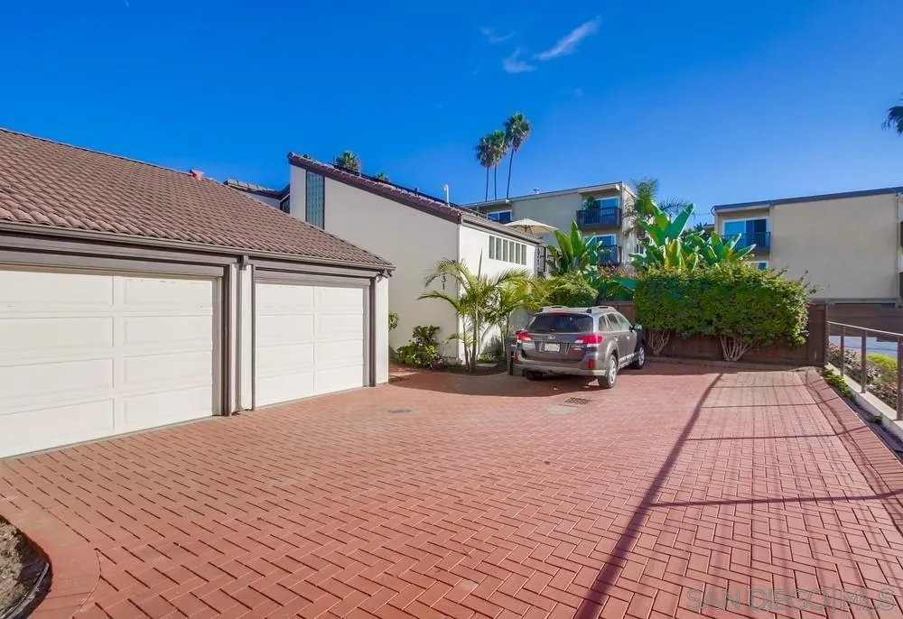 141 Sea Cliff Way Del Mar, CA 92014 - Photo 51 of 65 a car parked on the side of a building
