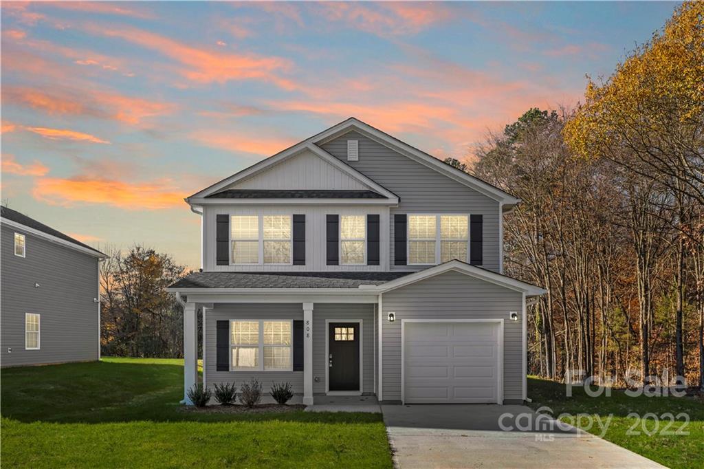 808 McDonald Road Charlotte, NC 28214 - Photo 1 of 30 a front view of a house with a garden