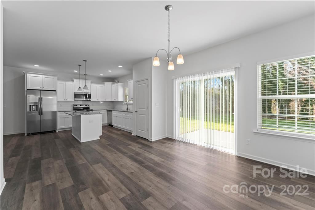 808 McDonald Road Charlotte, NC 28214 - Photo 11 of 30 a view of a kitchen with wooden floor and windows