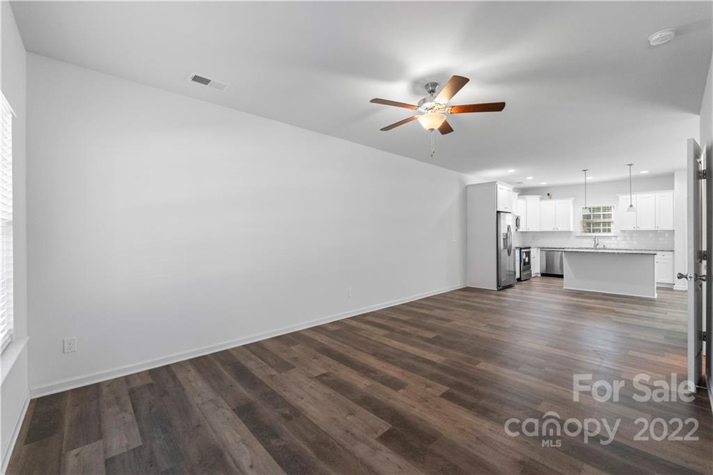 808 McDonald Road Charlotte, NC 28214 - Photo 13 of 30 a view of a kitchen with a sink and a chandelier fan