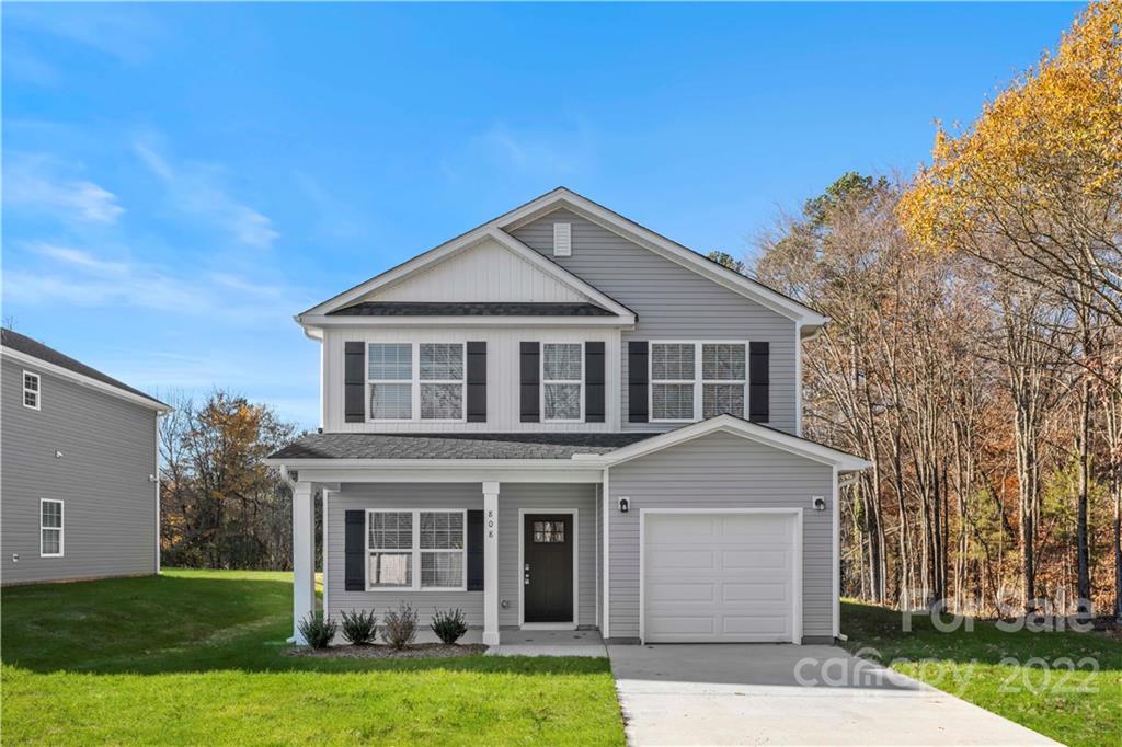 808 McDonald Road Charlotte, NC 28214 - Photo 2 of 30 a front view of a house with a garden and yard