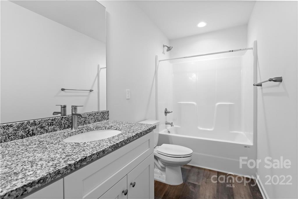 808 McDonald Road Charlotte, NC 28214 - Photo 21 of 30 a bathroom with a granite countertop sink toilet and shower