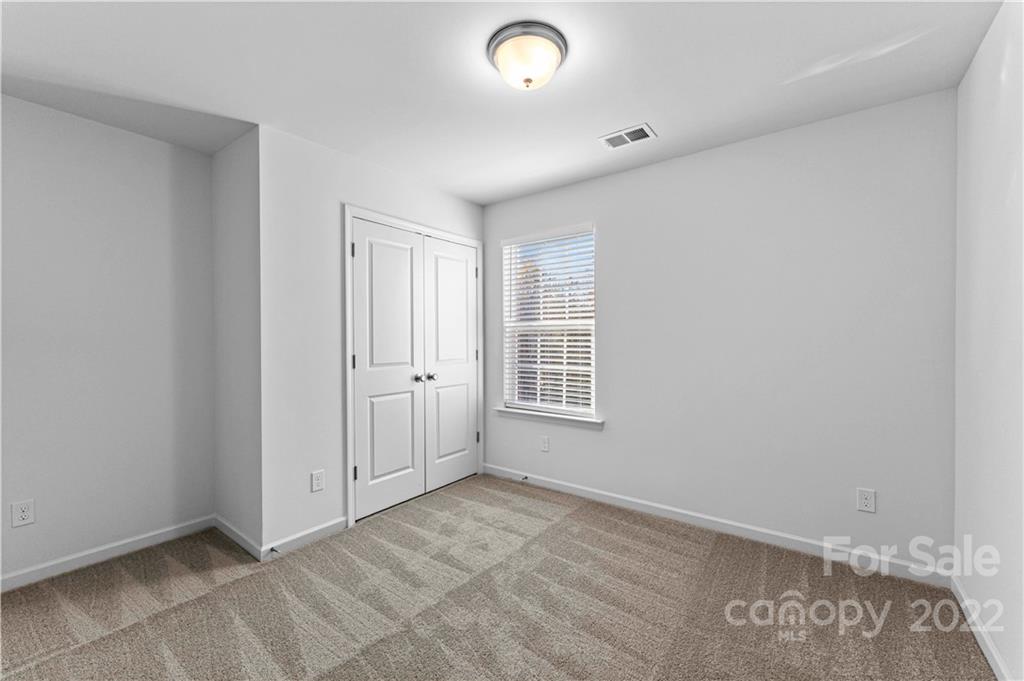 808 McDonald Road Charlotte, NC 28214 - Photo 22 of 30 an empty room with windows