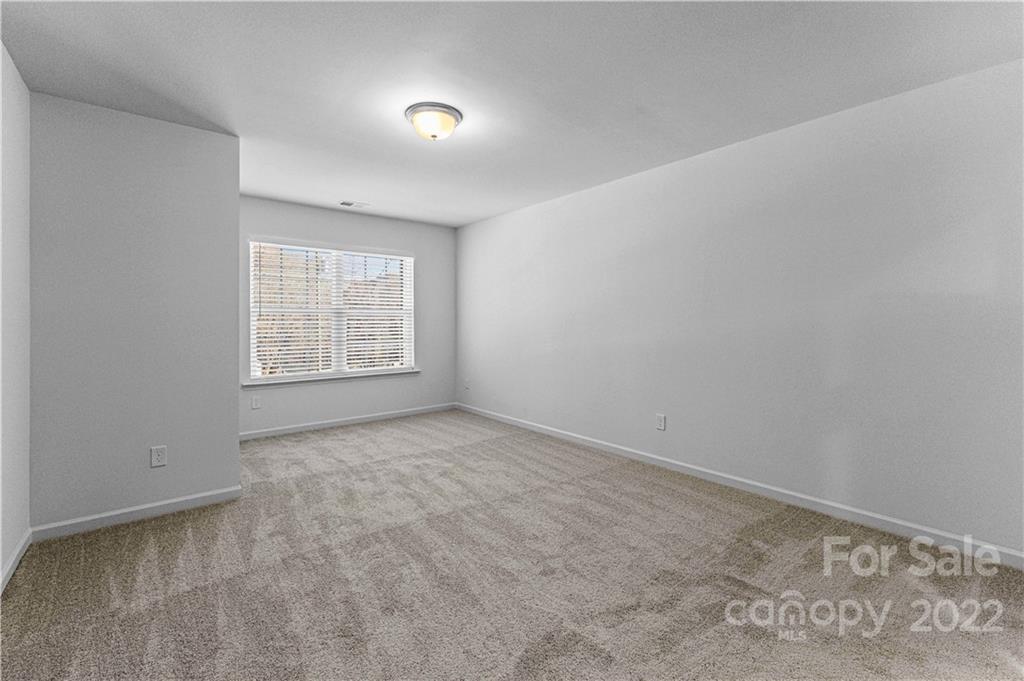 808 McDonald Road Charlotte, NC 28214 - Photo 23 of 30 an empty room with windows