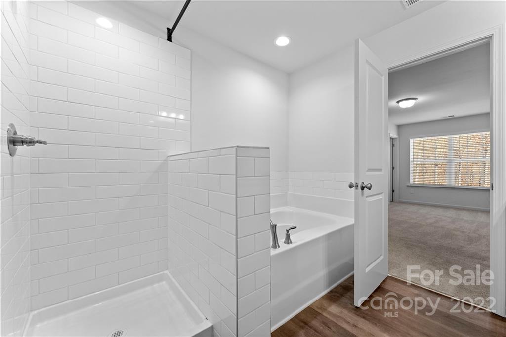 808 McDonald Road Charlotte, NC 28214 - Photo 24 of 30 a bathroom with a bathtub and shower