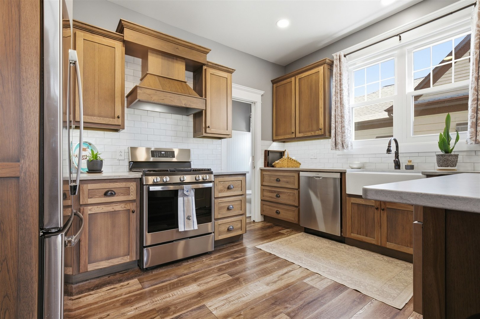 616 East Madison Street Pontiac, IL 61764 - Photo 11 of 37 a kitchen with stainless steel appliances a stove sink and cabinets