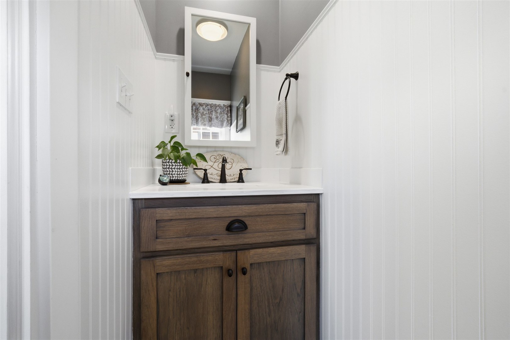 616 East Madison Street Pontiac, IL 61764 - Photo 14 of 37 a bathroom with a sink and a mirror