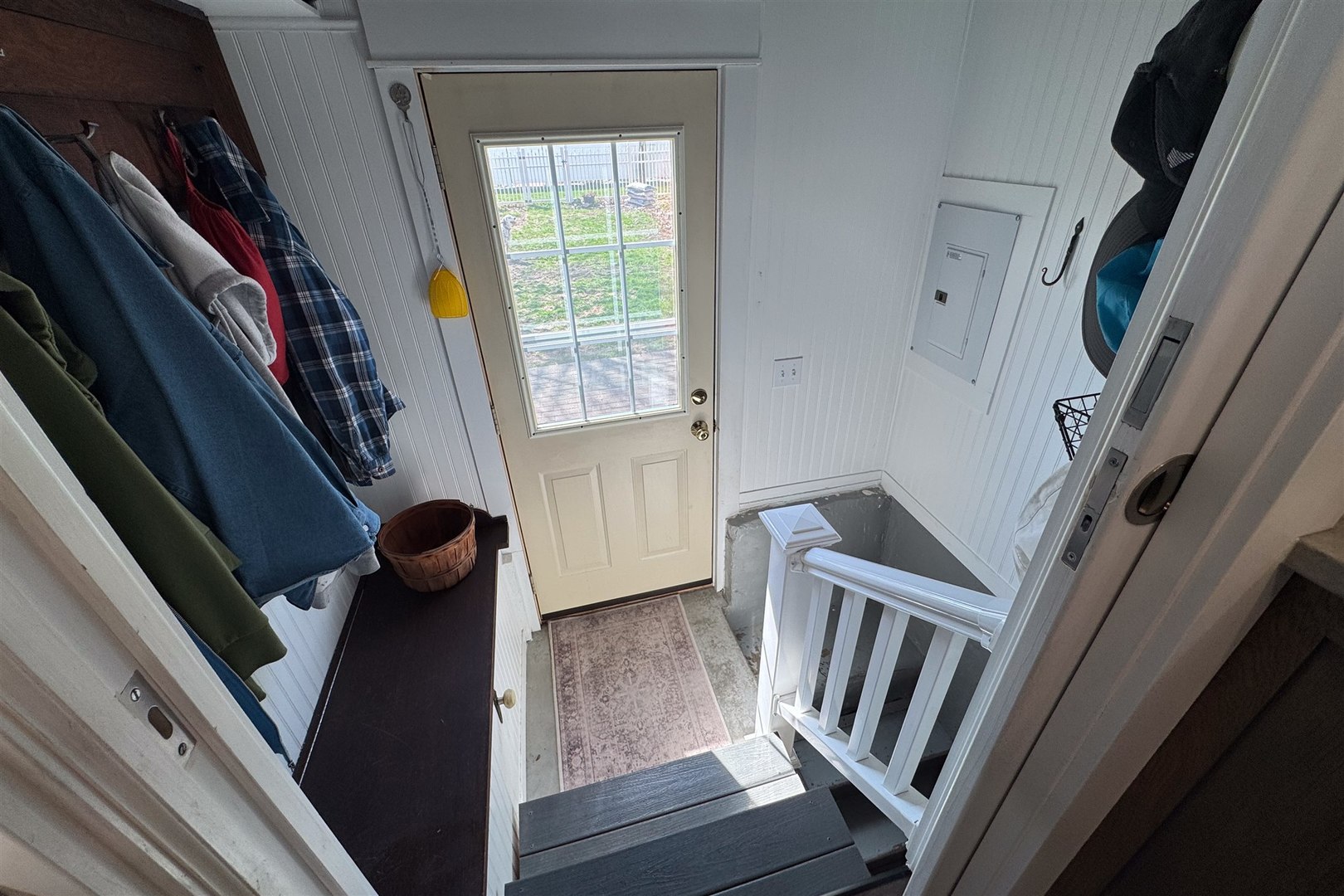 616 East Madison Street Pontiac, IL 61764 - Photo 25 of 37 a view of an empty room with wooden floor and stairs