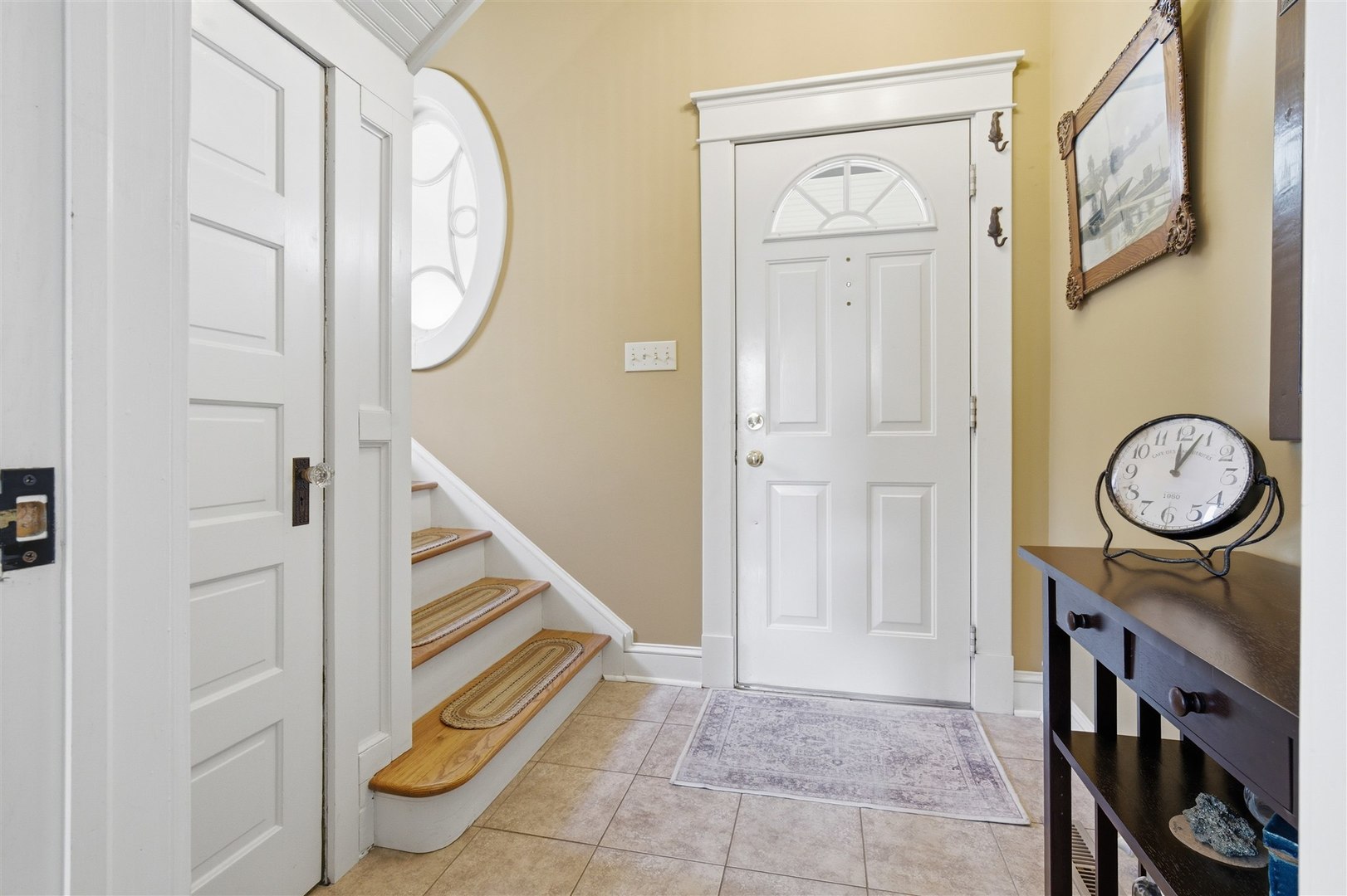 616 East Madison Street Pontiac, IL 61764 - Photo 3 of 37 a view of a hallway with entryway wooden floor front door and front door