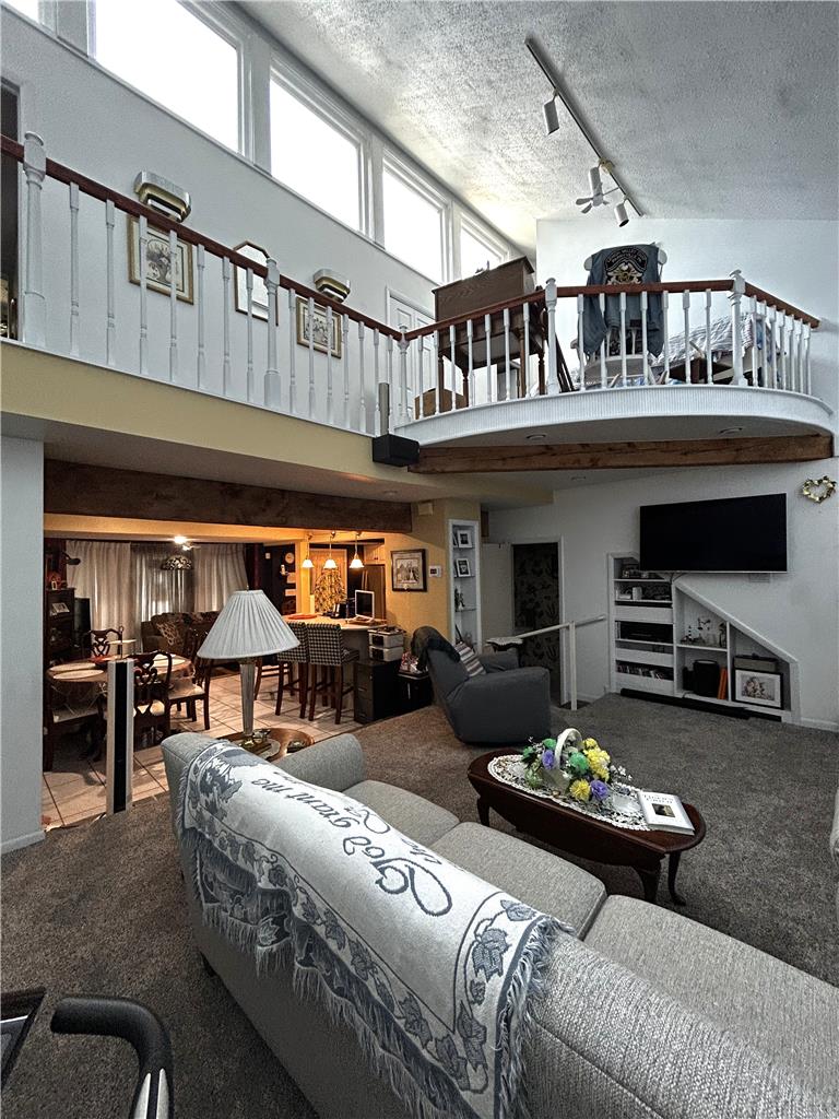 1214 Stanford Road Bethlehem, PA 18018 - Photo 29 of 63 A spacious living area with a unique mezzanine level overlooks a dining nook and kitchen.