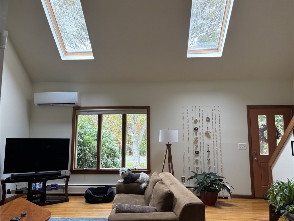 75 State Street Amherst, MA 01002 - Photo 11 of 39 a living room with furniture and a flat screen tv