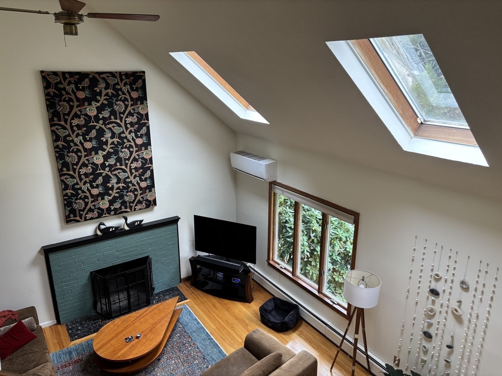 75 State Street Amherst, MA 01002 - Photo 14 of 39 a living room with furniture and a fireplace