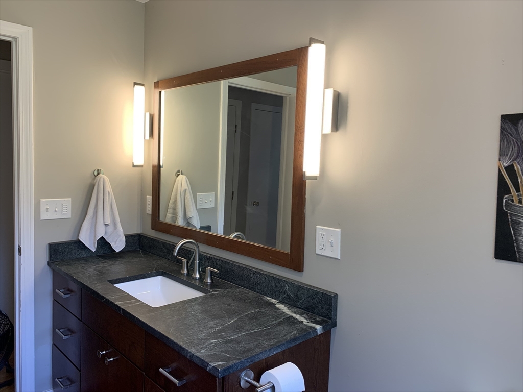 75 State Street Amherst, MA 01002 - Photo 15 of 39 a bathroom with a sink and a mirror