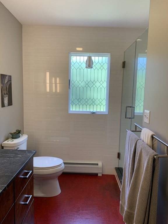 75 State Street Amherst, MA 01002 - Photo 16 of 39 a bathroom with a sink toilet and a mirror