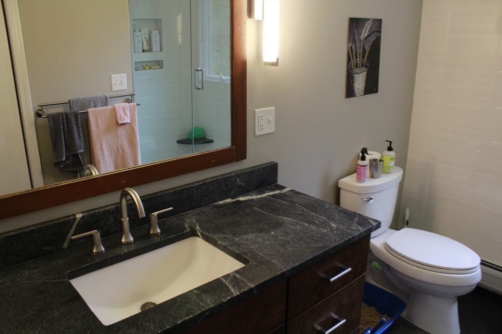 75 State Street Amherst, MA 01002 - Photo 17 of 39 a bathroom with a sink toilet and mirror