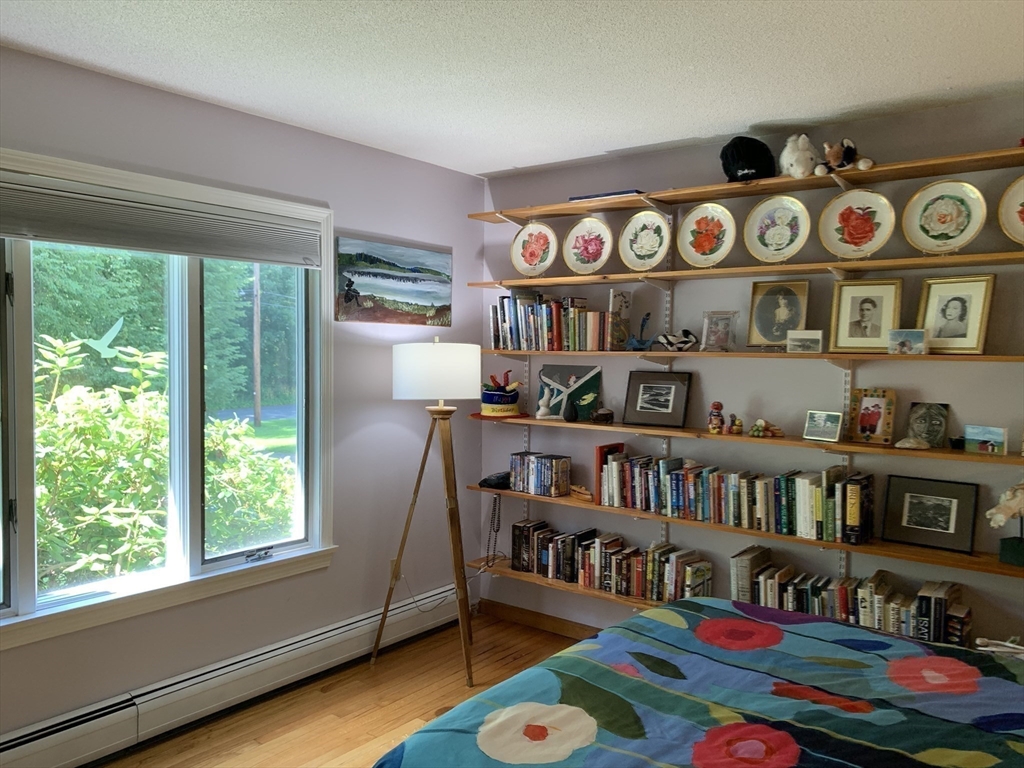 75 State Street Amherst, MA 01002 - Photo 21 of 39 a room with lots of furniture and a book shelf