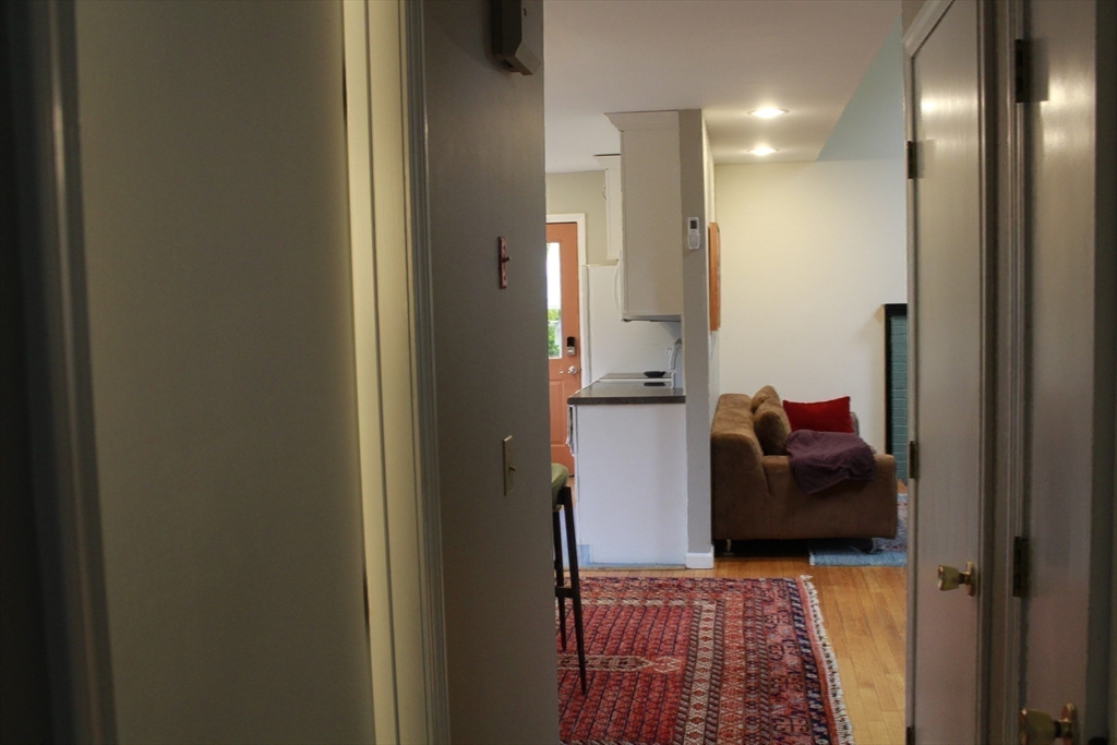 75 State Street Amherst, MA 01002 - Photo 22 of 39 a view of hallway with livingroom and couch