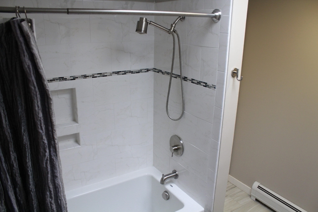 75 State Street Amherst, MA 01002 - Photo 27 of 39 a bathroom with a shower and a bath tub