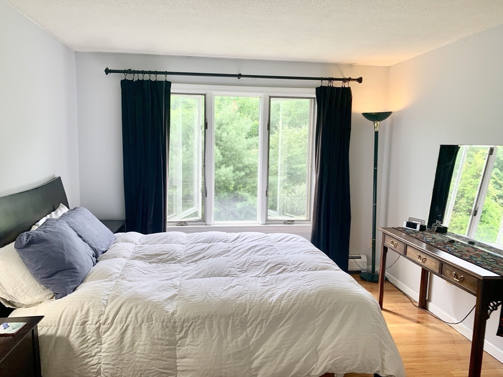 75 State Street Amherst, MA 01002 - Photo 28 of 39 a bedroom with a bed and a large window