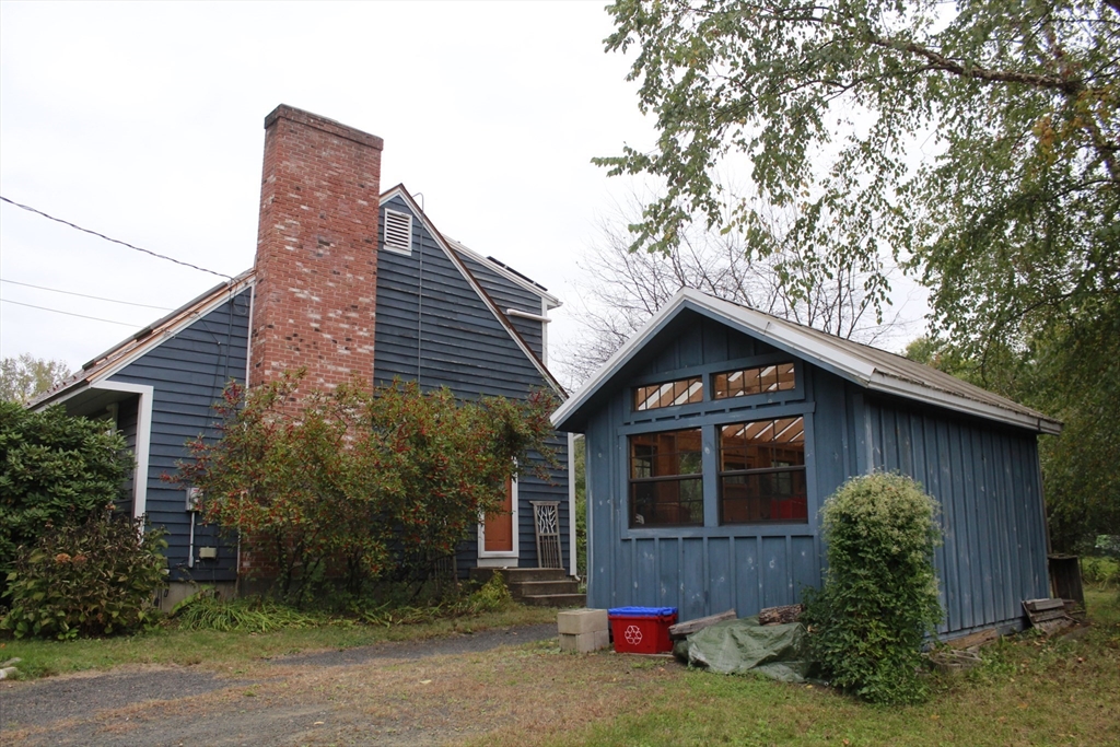 75 State Street Amherst, MA 01002 - Photo 3 of 39 a front view of house with yard and trees around