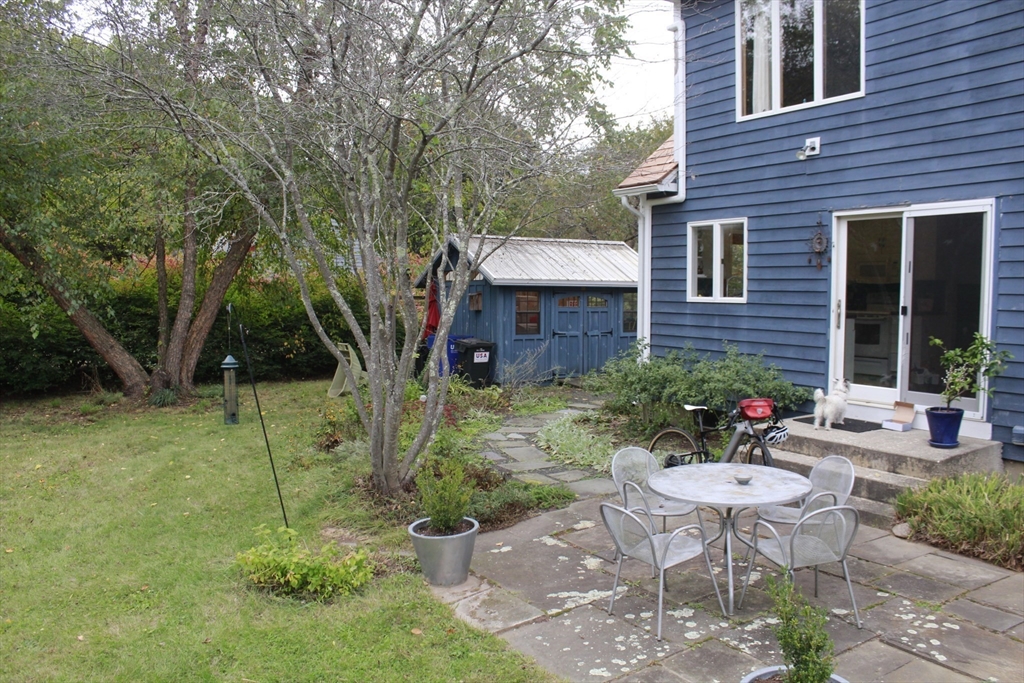 75 State Street Amherst, MA 01002 - Photo 8 of 39 a view of a chair and table in backyard of the house