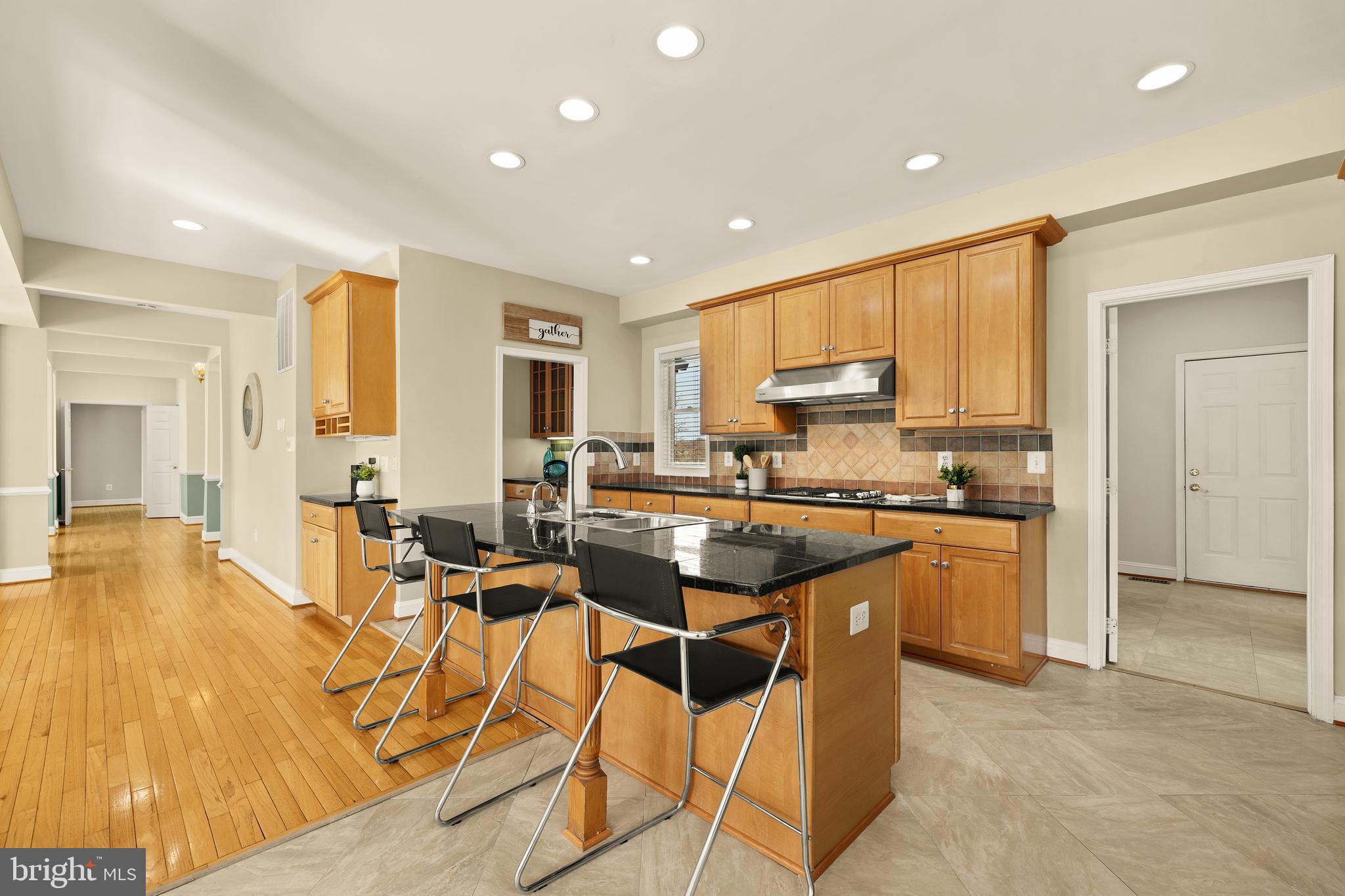 20407 Peach Tree Road Dickerson, MD 20842 - Photo 11 of 53 a open kitchen with stainless steel appliances granite countertop a stove and a refrigerator
