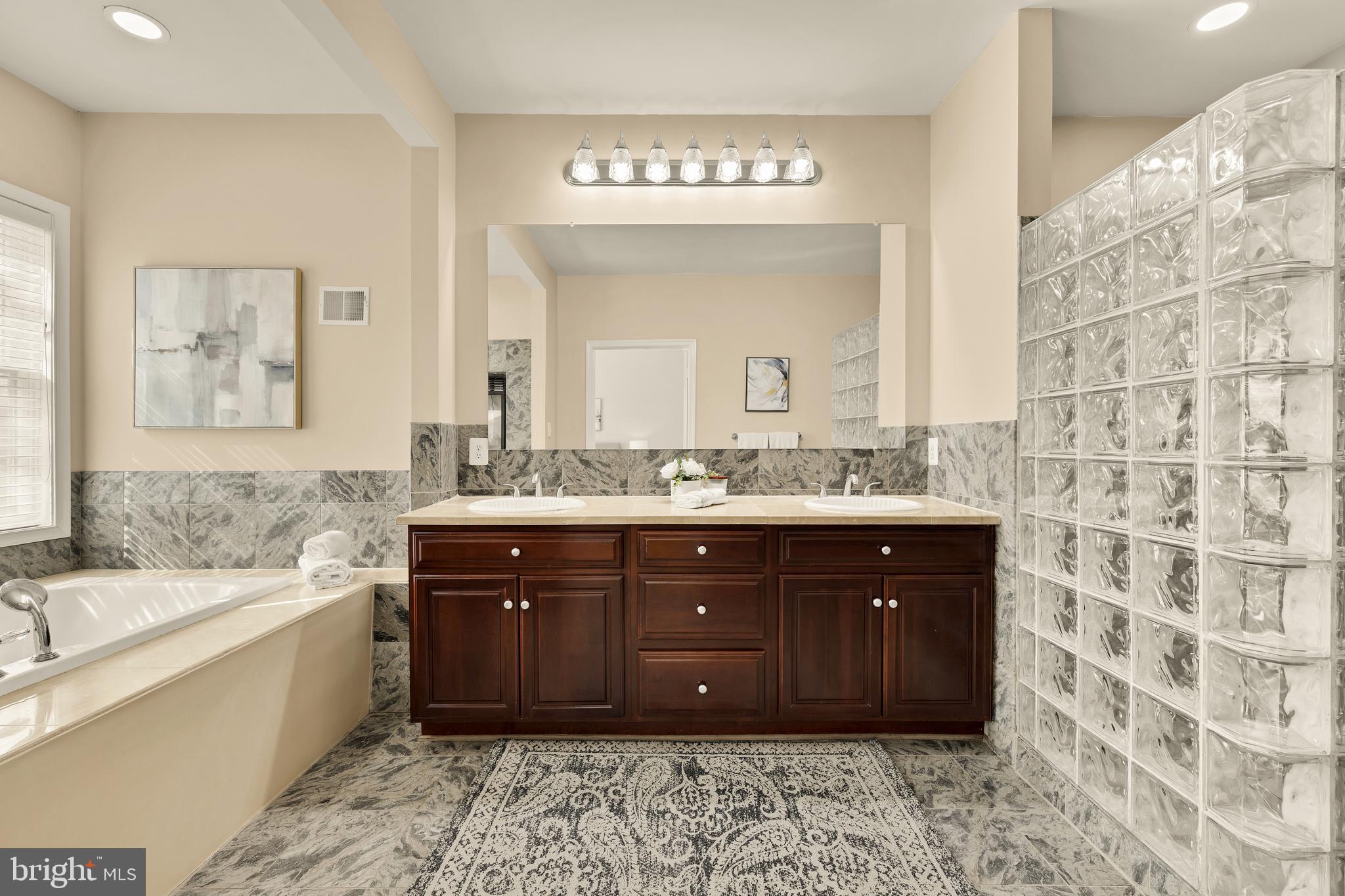 20407 Peach Tree Road Dickerson, MD 20842 - Photo 23 of 53 a spacious bathroom with a tub sink and mirror