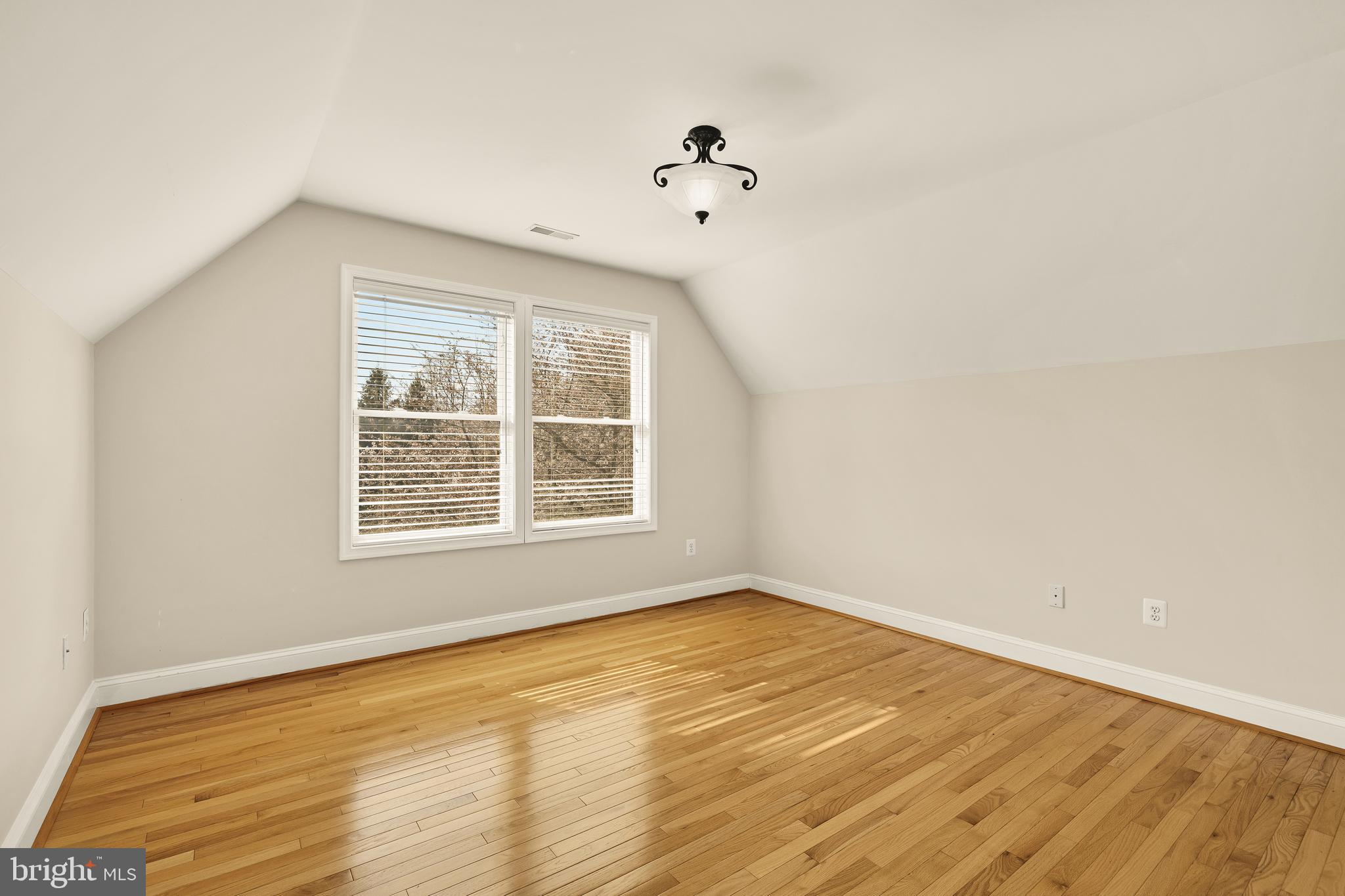 20407 Peach Tree Road Dickerson, MD 20842 - Photo 26 of 53 a view of an empty room with wooden floor and a window