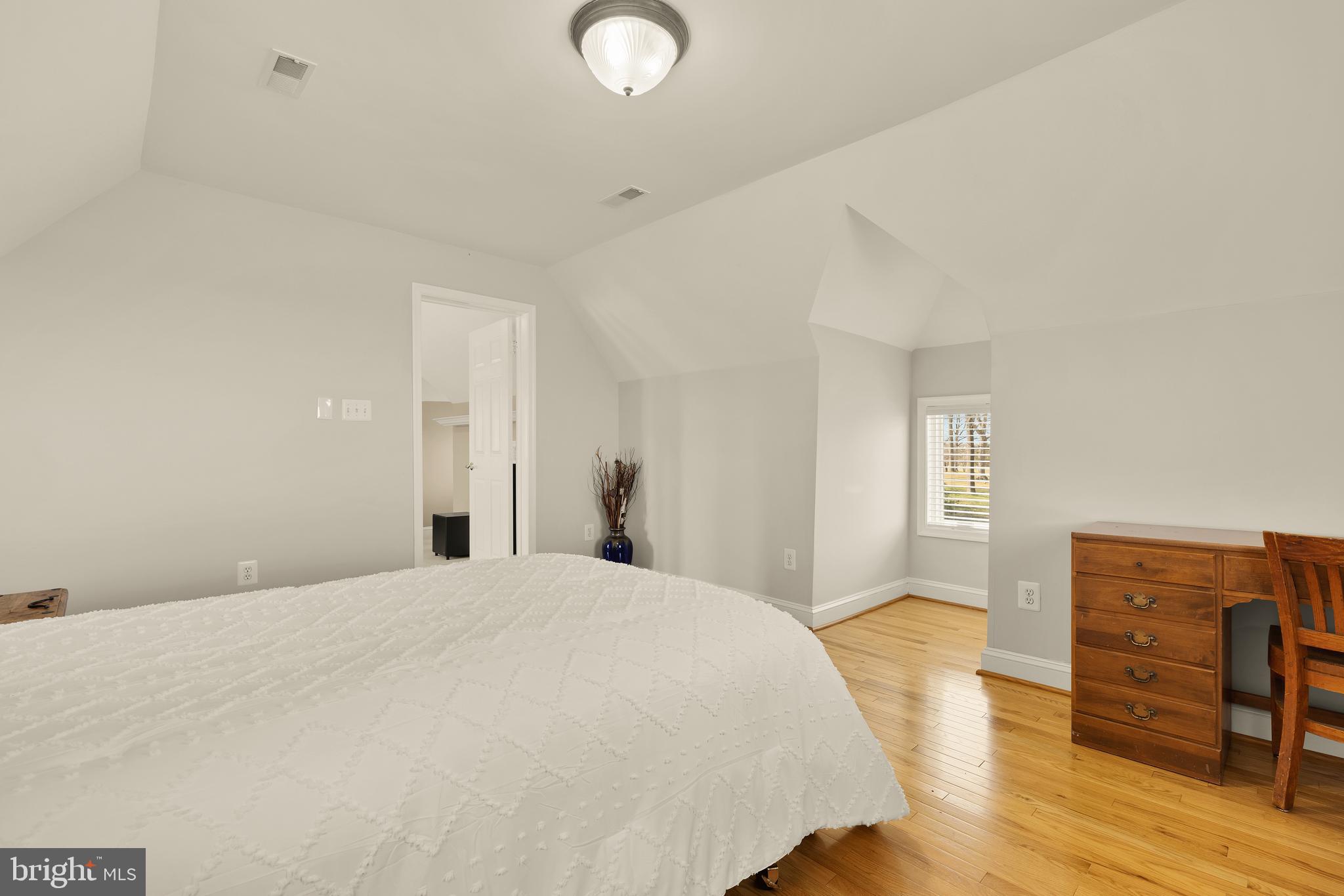 20407 Peach Tree Road Dickerson, MD 20842 - Photo 36 of 53 a bedroom with a bed and wooden floor