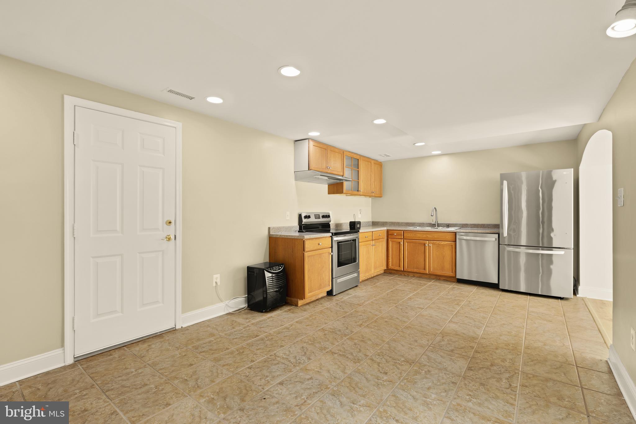 20407 Peach Tree Road Dickerson, MD 20842 - Photo 43 of 53 a kitchen with a sink and stainless steel appliances