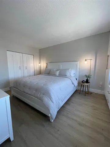 a view of a living room with a chair and a fireplace