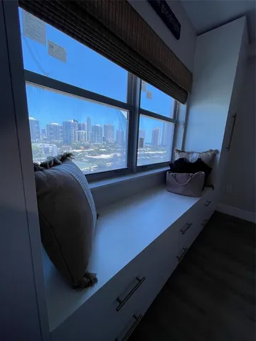 a view of a lake with tall buildings