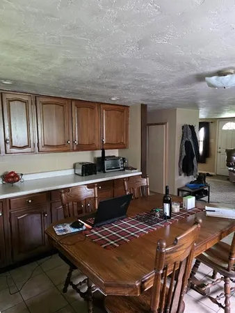 a kitchen with a sink appliances and cabinets
