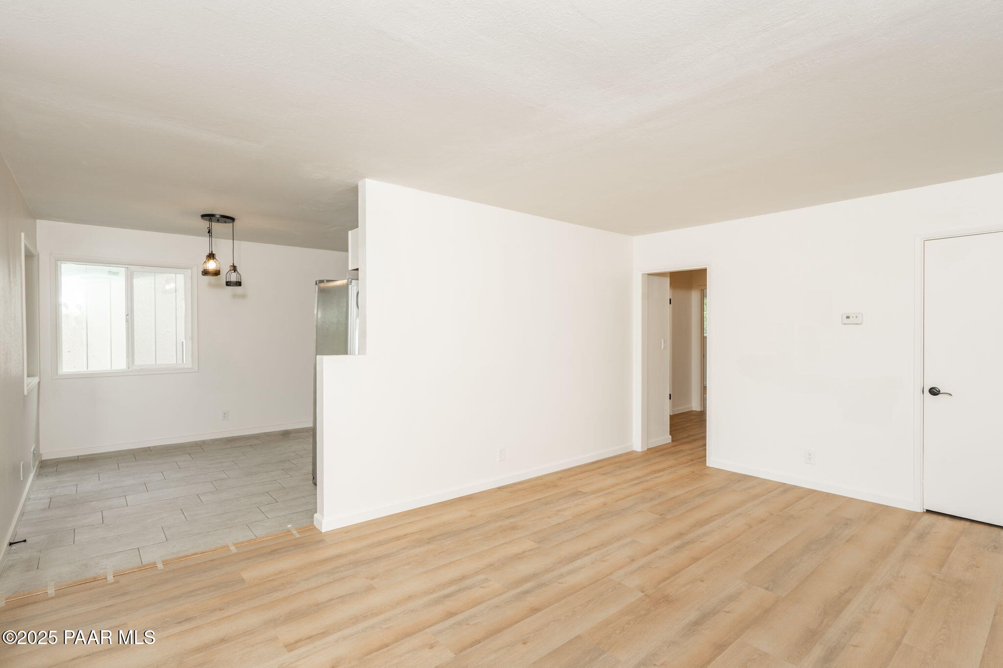 1213 Stetson Road Prescott, AZ 86303 - Photo 11 of 34 a view of a big room with wooden floor and windows