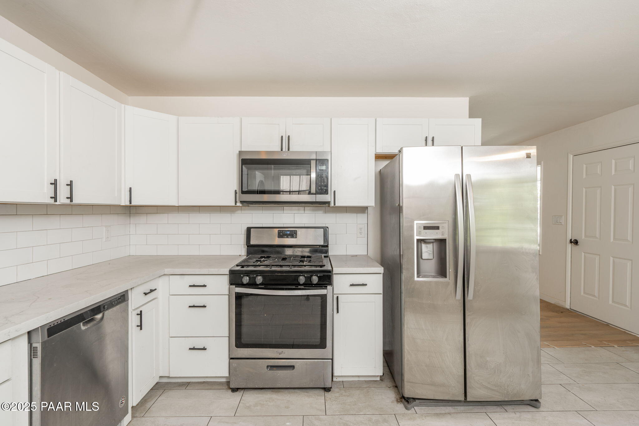 1213 Stetson Road Prescott, AZ 86303 - Photo 14 of 34 a kitchen with stainless steel appliances a refrigerator stove and sink