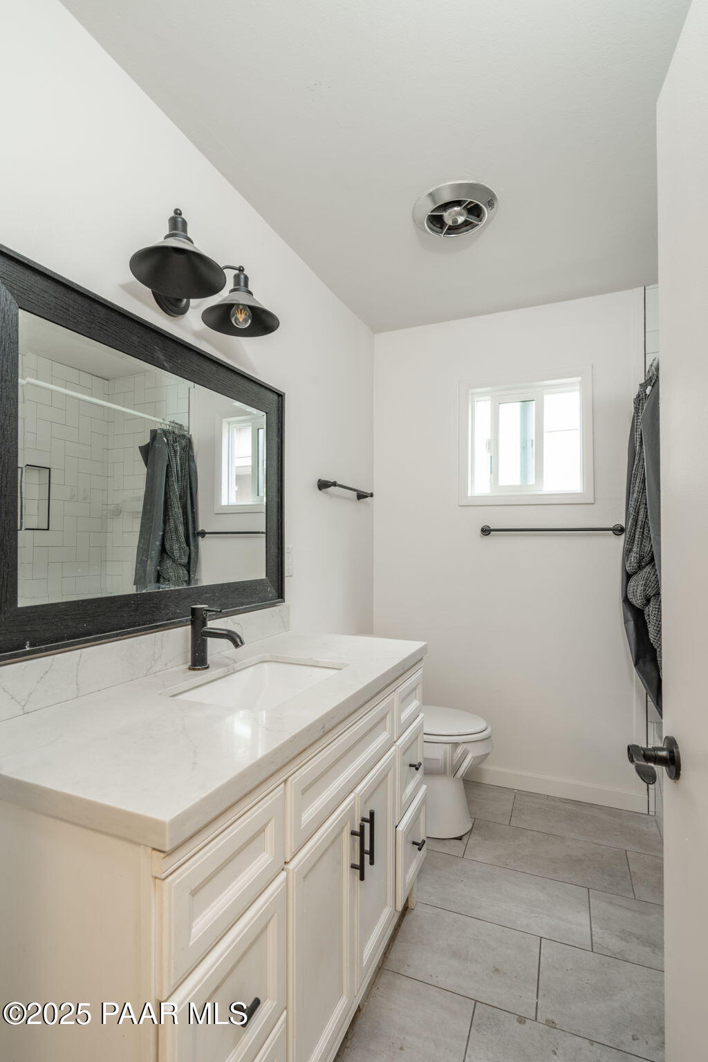 1213 Stetson Road Prescott, AZ 86303 - Photo 22 of 34 a bathroom with a sink a toilet and mirror