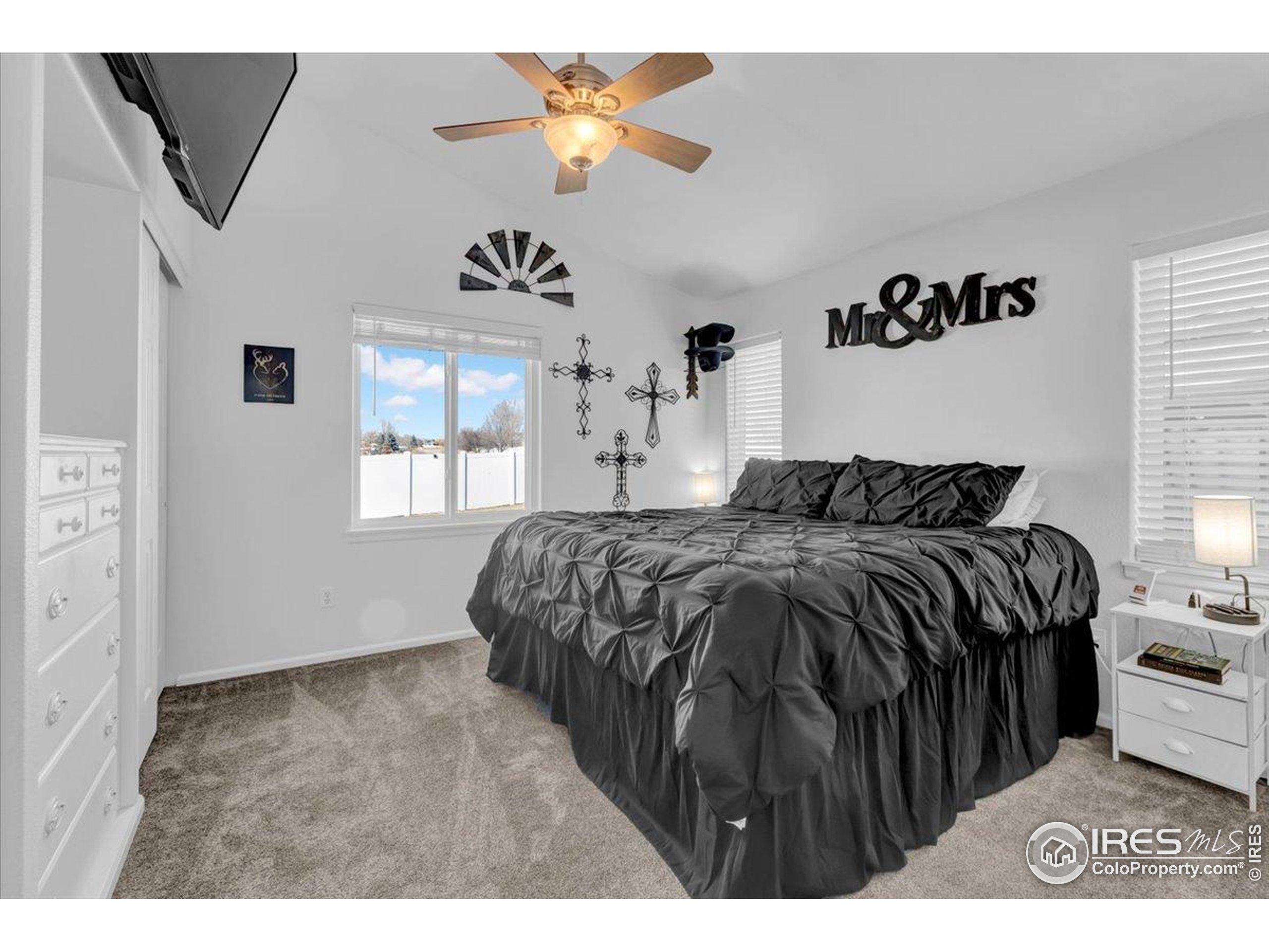 3411 Riesling Court Evans, CO 80634 - Photo 14 of 43 a bedroom with a bed and a window