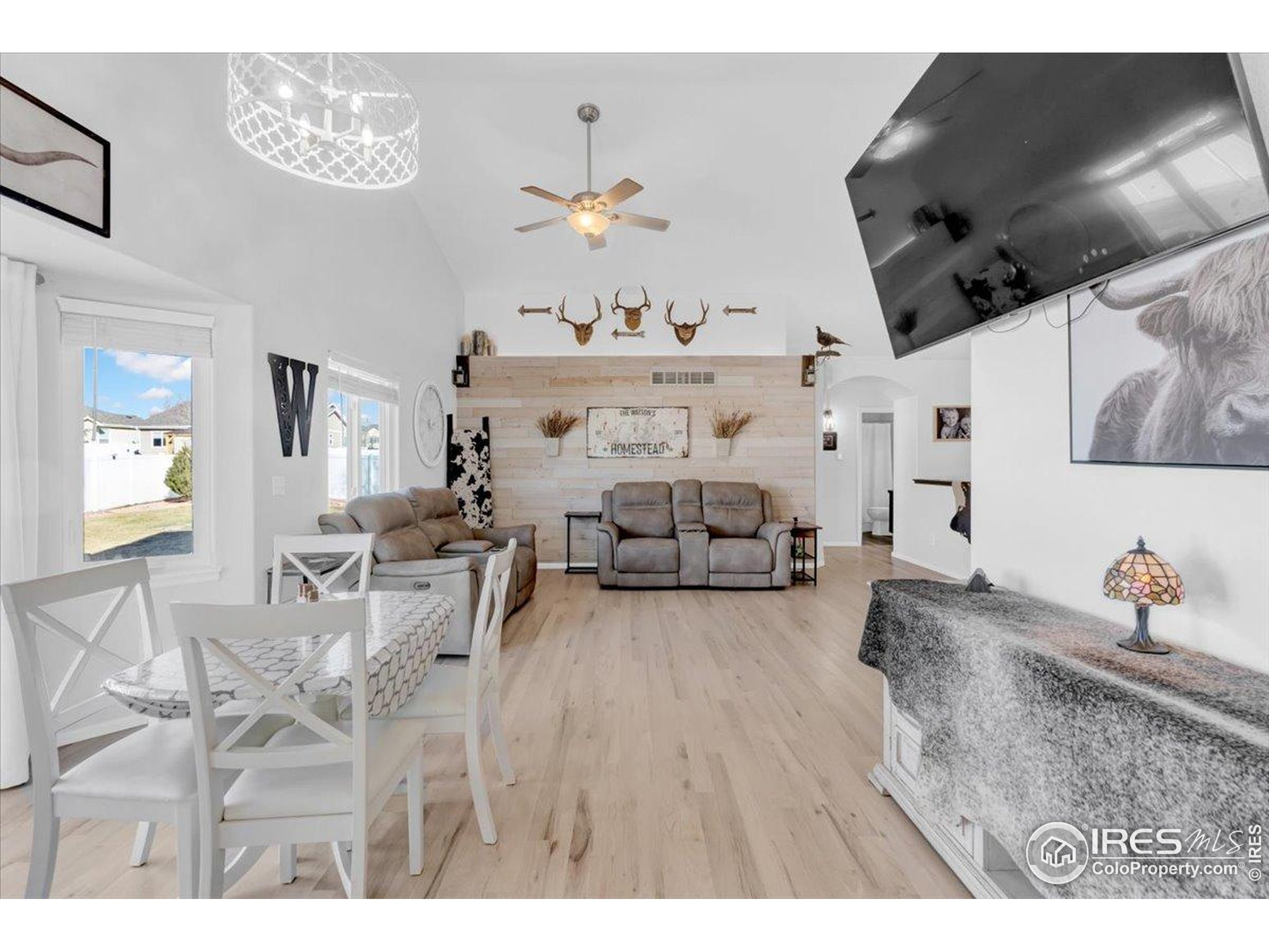 3411 Riesling Court Evans, CO 80634 - Photo 15 of 43 a living room with furniture and wooden floor
