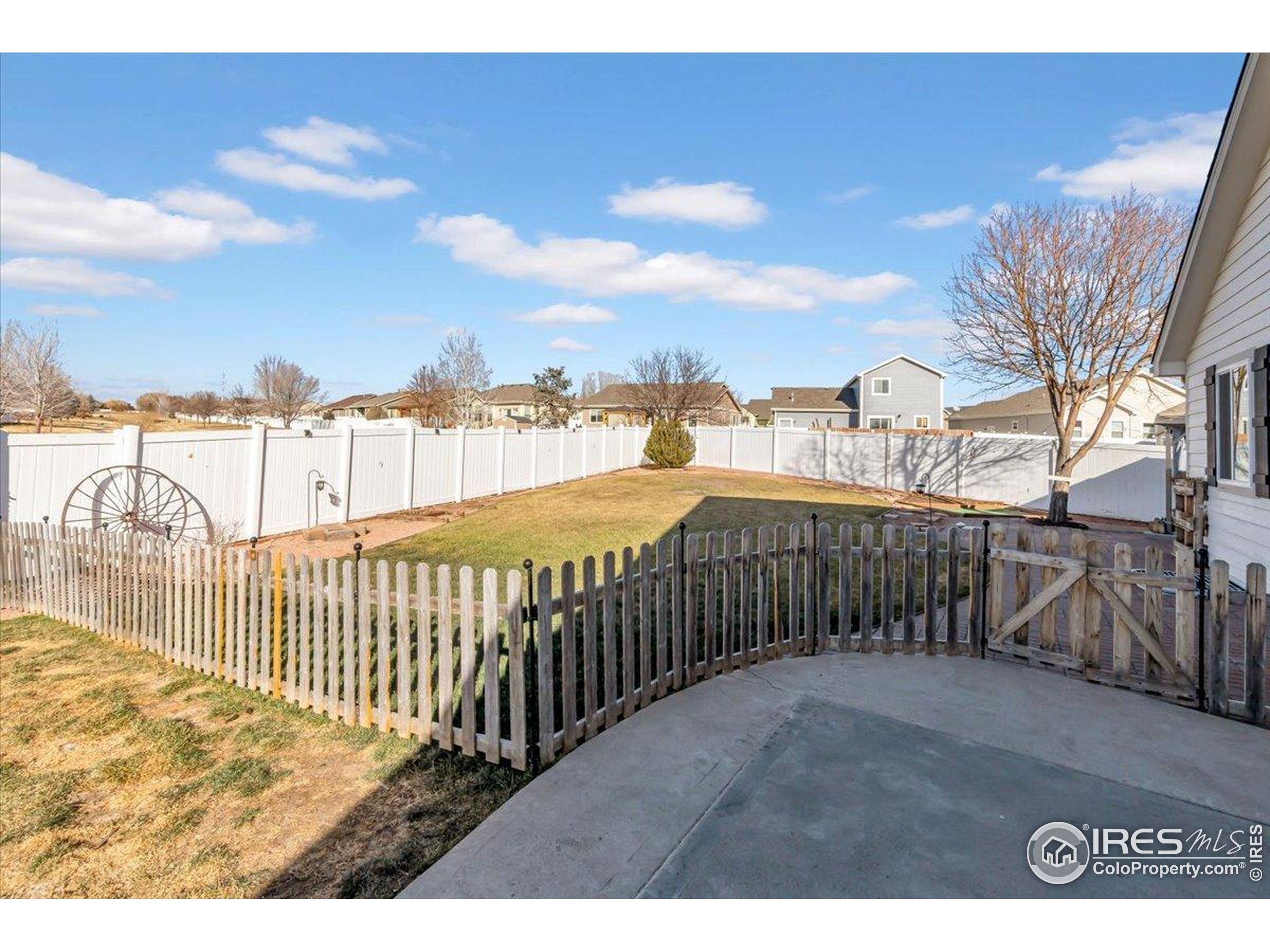 3411 Riesling Court Evans, CO 80634 - Photo 23 of 43 a view of a balcony with wooden fence