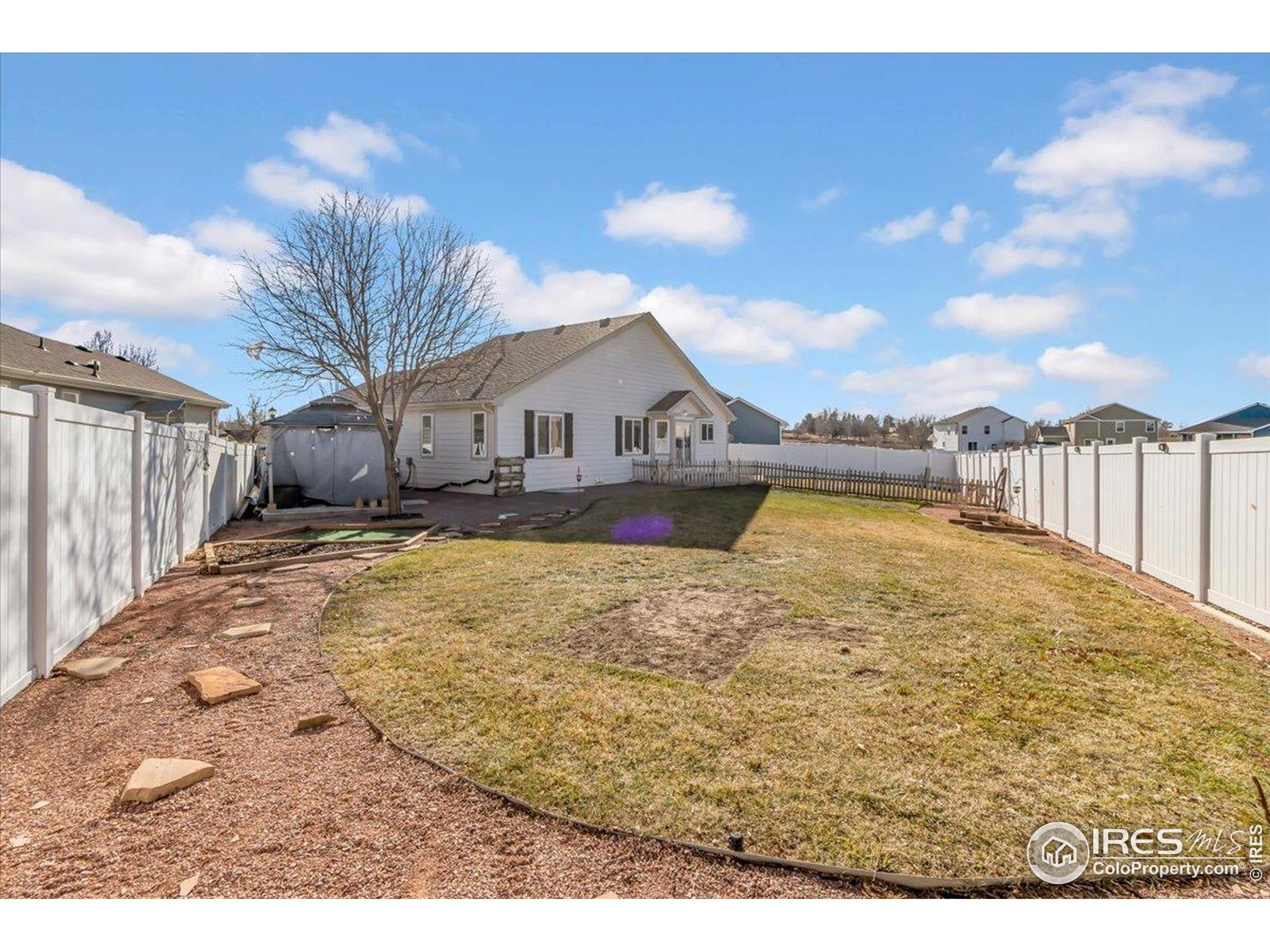 3411 Riesling Court Evans, CO 80634 - Photo 24 of 43 a view of a house with a yard