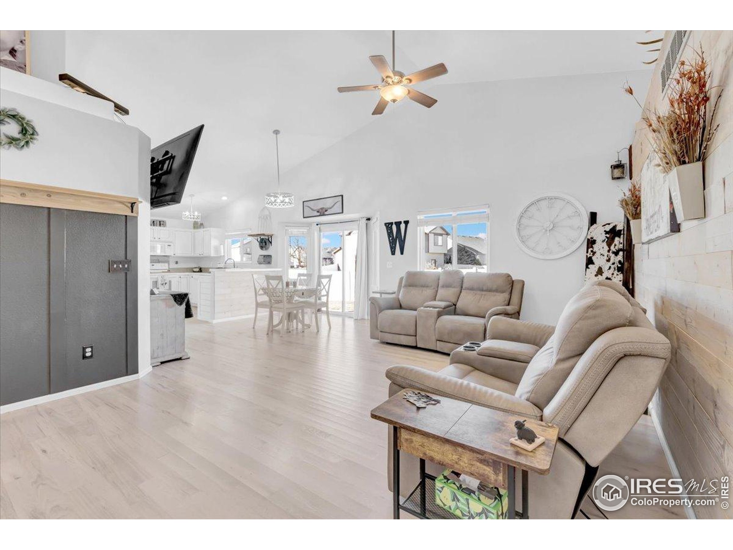 3411 Riesling Court Evans, CO 80634 - Photo 7 of 43 a living room with furniture and a view of kitchen