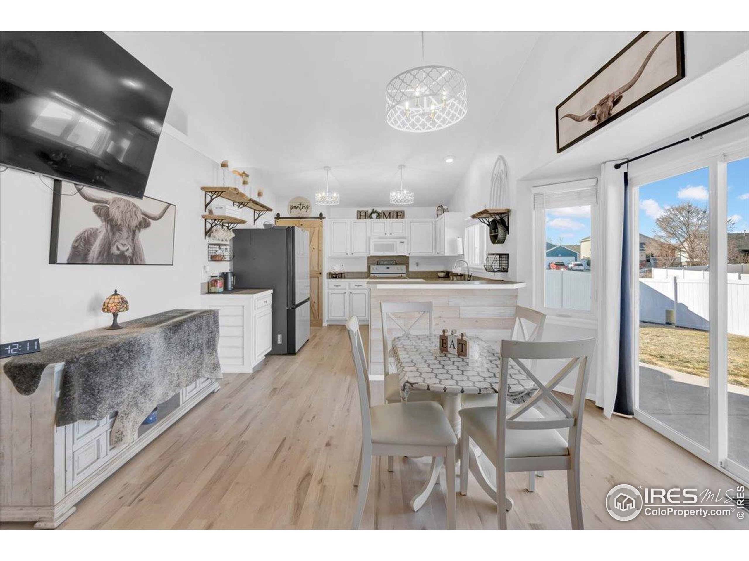 3411 Riesling Court Evans, CO 80634 - Photo 9 of 43 a view of a dining room kitchen and a wooden floor