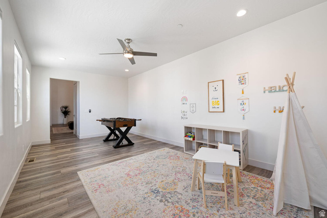 4281 Canterbury Road Hurricane, UT 84737 - Photo 14 of 24 Spacious room featuring wood-finish flooring, recessed lighting, a modern ceiling fan, and multiple windows