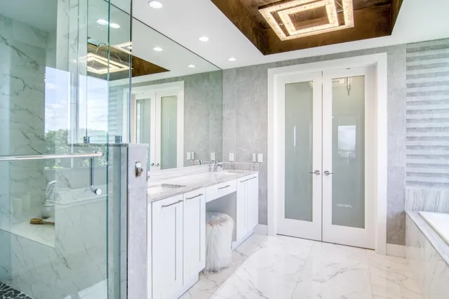 a bathroom with a double vanity sink and a mirror