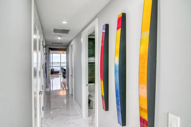 a very nice looking room with a large window and couch