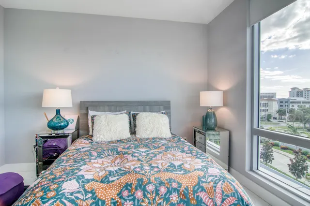 a bedroom with a bed and window