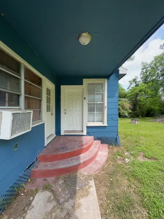 a view of a backyard of the house